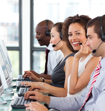 A group of people working on computers