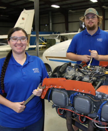 Julia Faris (left), a TSTC aviation maintenance graduate, and Matt Stokes, a TSTC aviation maintenance student, recently were hired as full-time aircraft airframe and powerplant mechanics with Envoy Air.