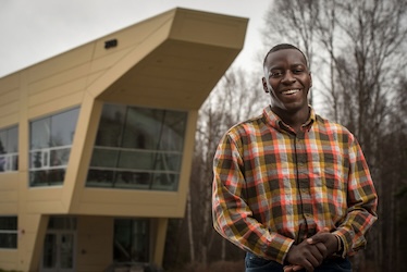 Civil engineering and project management alumnus Mohamed Niagne, photographed in front of UAA's ANSEP Building in May 2018. (Photo by James Evans / University of Alaska Anchorage)