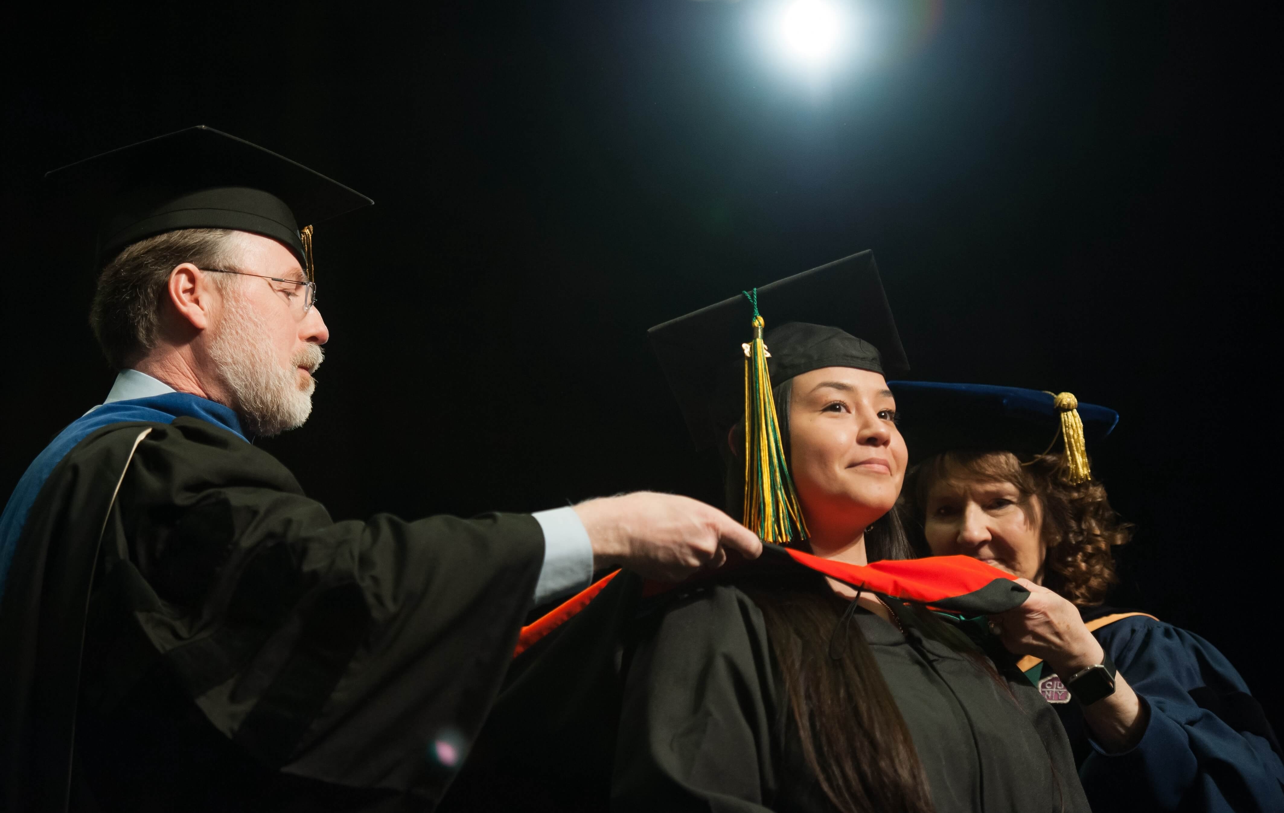 Forest Rose Walker, EMGT MS, is hooded during the UAA Spring 2018 Graduate Degree Hooding Ceremony.