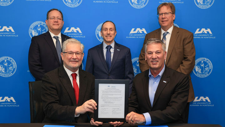 Joe Baldwin, Manager, Dassault Systèmes North America – Academics, and Col. John W. Jones, Director of the Aviation Test Laboratory at UAH, seated signed an agreement Standing behind them are Bill DeVries, Vice President Industry Transformation and Customer Success at Dassault Systèmes; Dr. David A. Puleo, Provost and Executive Vice President for Academic Affairs at UAH, and Dr. Robert Lindquist, Vice President for Research and Economic Development at UAH