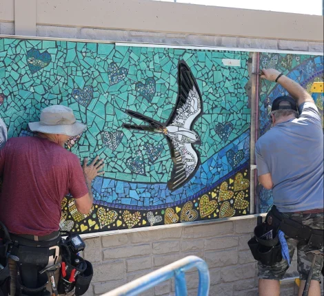 Artists working on mural