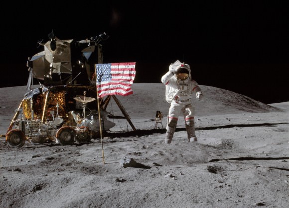 John W. Young on the Moon during Apollo 16 mission. Charles M. Duke Jr. took this picture. The LM Orion is on the left. April 21, 1972. Credit: NASA