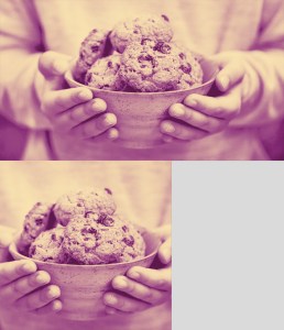 a pair of hands holding a bowl full of cookies