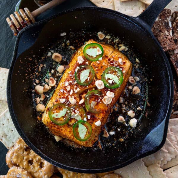 Smoked Cream Cheese topped with jalapeños and hot honey in a serving dish