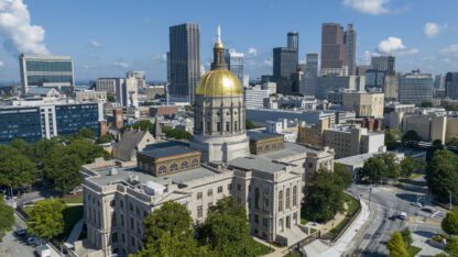 The gold dome of the Georgia Capitol gleams in the sun, Aug. 27, 2022.