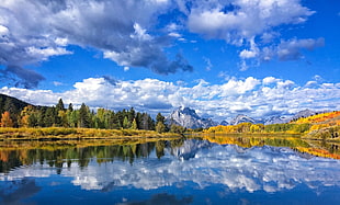 body of water over mountain under blue and cloudy sky, photography, nature, landscape, river