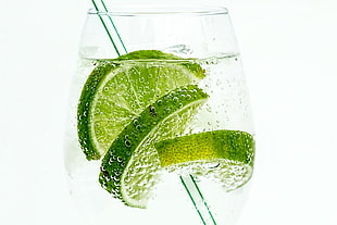 clear drinking glass with water and lime