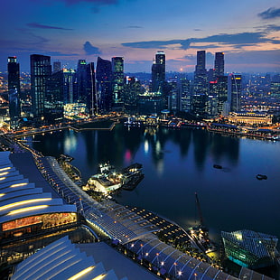 top view of city beside body of water during nighttime