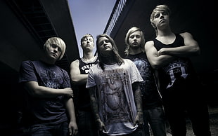 five men standing taking photo during nighttime