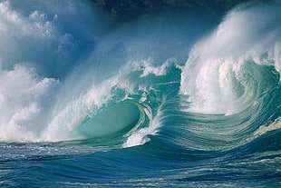 blue body of water waves photo