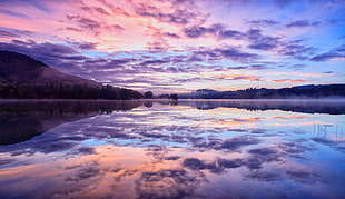 calm body of water under blue sky, loch achray, scotland