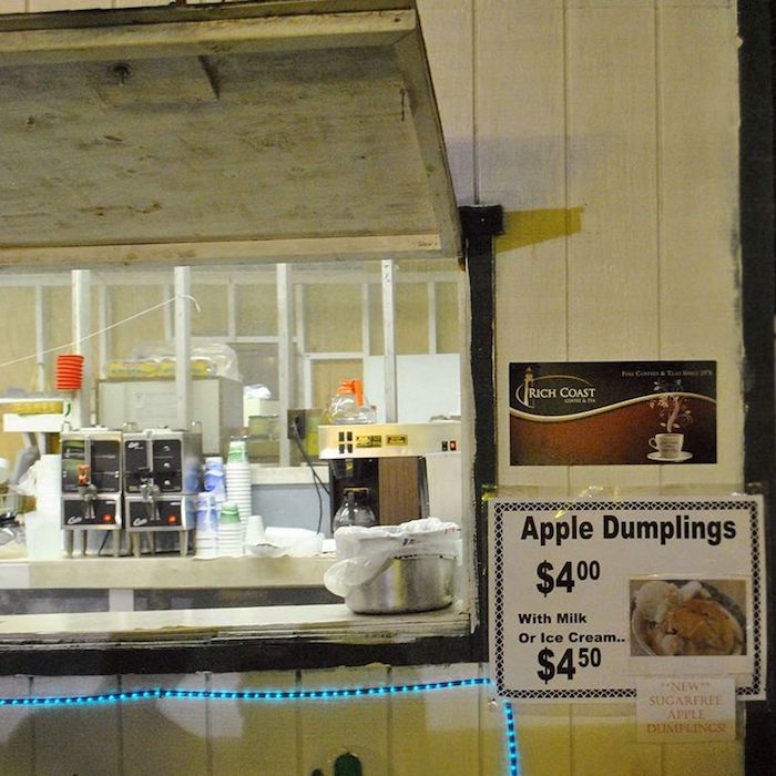 Food stall selling apple dumplings at the Centre County Grange Fair, one of the best things to do in Central Pennsylvania.