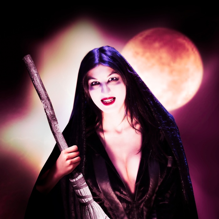 Sexy Witch against moonlight