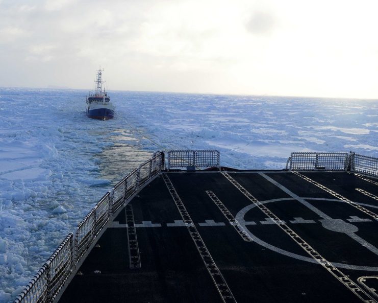 Disabled fishing vessel Antarctic Chieftain is towed astern of the Coast Guard Cutter Polar Star through sea ice near Antarctica, Feb. 14, 2015