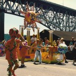 "Solstice Parade 1992 Aurora Bridge" by Joe Mabel - Photo by Joe Mabel. Licensed under CC BY-SA 3.0 via Commons - https://commons.wikimedia.org/wiki/File:Solstice_Parade_1992_Aurora_Bridge.jpg#/media/File:Solstice_Parade_1992_Aurora_Bridge.jpg