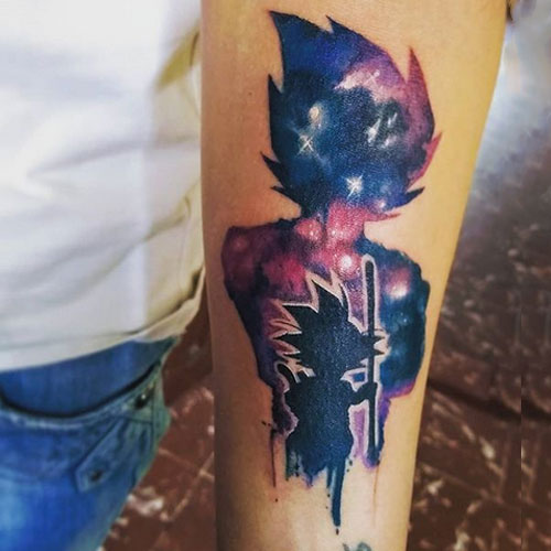 goku holding stick tattoo on arm