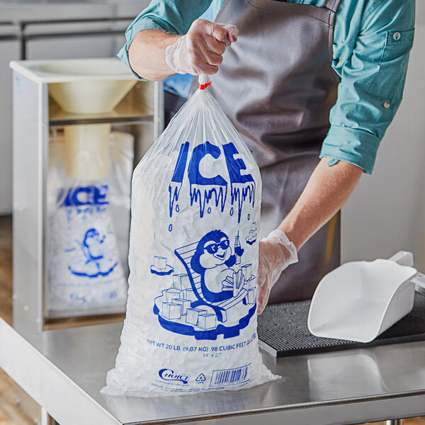 A person holding a Choice clear plastic ice bag with ice print.