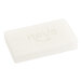 A white rectangular wrapped soap bar with black and white text.