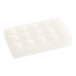 A white rectangular soap bar with a circle design on a white surface.