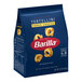 A blue bag of Barilla Collezione Three Cheese Tortellini pasta.