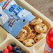 A tray of Pillsbury Soft-Baked Mini Chocolate Chip Cookies with a close up of a cookie.