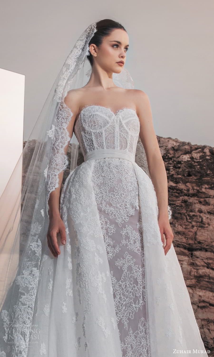 zuhair murad spring 2025 bridal sheer detached long sleeves scalloped neckline embellished lace sheath wedding dress a line overskirt chapel train (3) zv