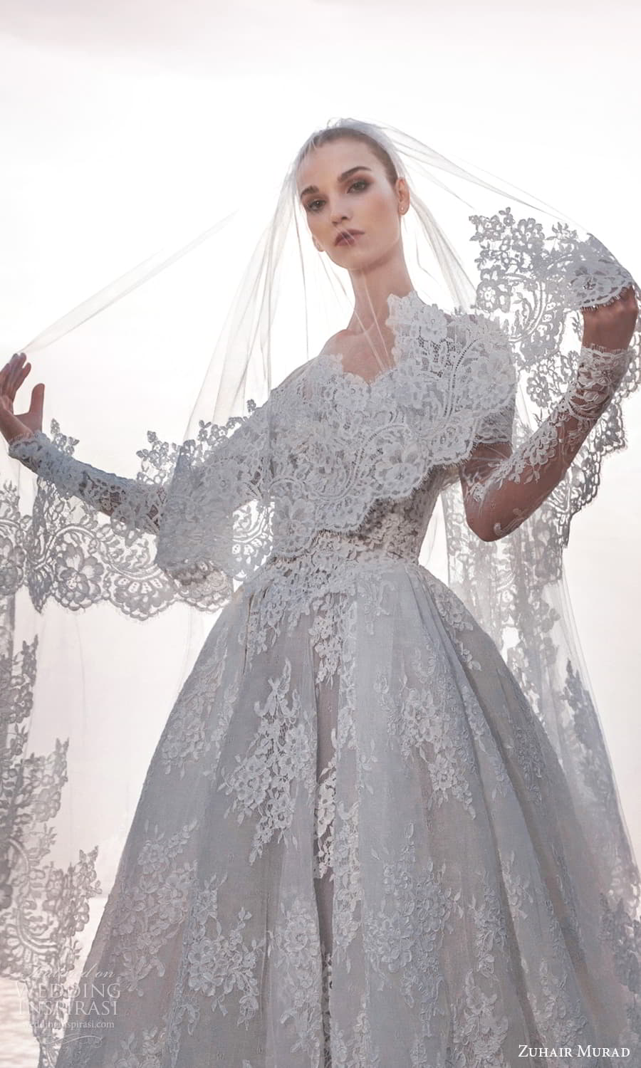 zuhair murad spring 2025 bridal sheer long sleeve off shoulder crumbcather neckline embellished lace basque waist ball gown wedding dress chapel train (12) zv