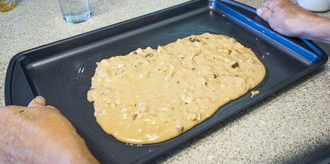 buttercrunch spread on on a baking sheet to cool