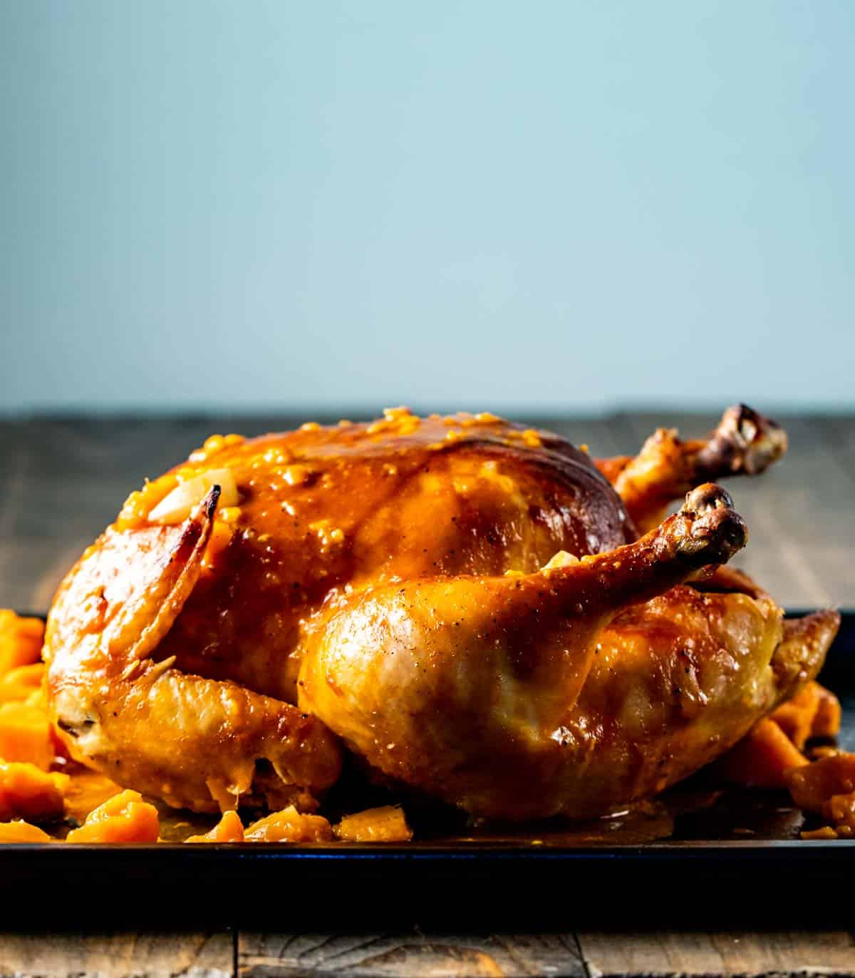 up close view of Gochujang Chicken on a serving platter ready to be carved