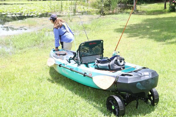 By comparison, my 13-foot, 2 inch Old Town Predator PDL does great for longer runs and bigger water, but at 117 pounds, this is a lot of boat to be moving every time I want to hit the lake behind my house, or take an impromptu short-range outing.
Moreover, my wife&rsquo;s past shoulder surgery makes it difficult for her to load/unload the big yak solo.
The Topwater 120 is significantly more substantial in design and solidity than the featherweight stuff you can buy at the big box stores, but my wife had no problem towing this boat to the lake on a C-Tug Sandtrackz cart and launching the boat.