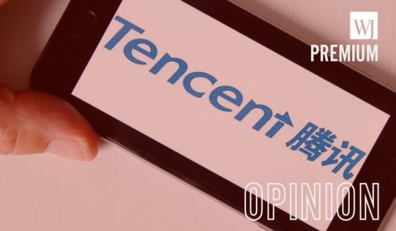 A photo illustration shows the logo of the world leader in video games, Tencent, displayed on the screen of an iPhone.