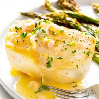 Sea bass recipe plated with asparagus.