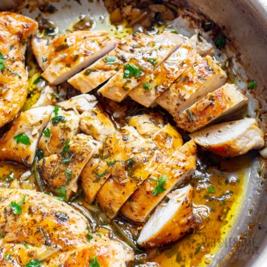 Garlic butter chicken sliced in a skillet.