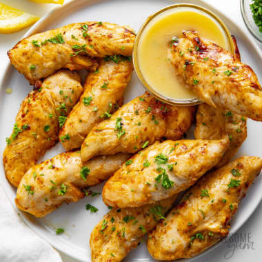 Air fryer chicken tenders (tenderloins) on a plate.