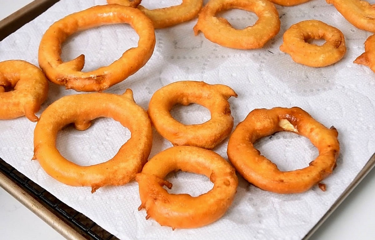 fried beer batter onion rings on a paper towel