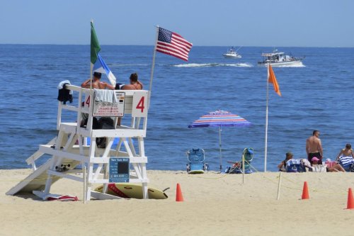 FILE - A boat passes by July 2, 2024, off Sea Girt, N.J., where a power cable from the Atlantic Shores offshore wind farm project is projected to come ashore. (AP Photo/Wayne Parry, File)