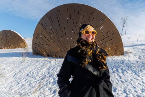 MIKE DEAL / FREE PRESS
                                Discover and enjoy more local art, says tamara rae biebrich of the Winnipeg Arts Council in front of one element of Jyhling Lee’s Outcroppings, on Waverley Street near Taylor Avenue.