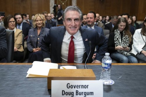 Former Gov. Doug Burgum, President-elect Donald Trump's choice to lead the the Interior Department as Secretary of the Interior, arrives to testify before the Senate Energy and Natural Resources Committee on Capitol Hill in Washington, Thursday, Jan. 16, 2025. (AP Photo/Jose Luis Magana)