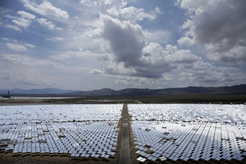 FILE - An array of mirrors at the Ivanpah Solar Electric Generating site is shown near Primm, Nev., Aug. 13, 2014. (AP Photo/John Locher, File)