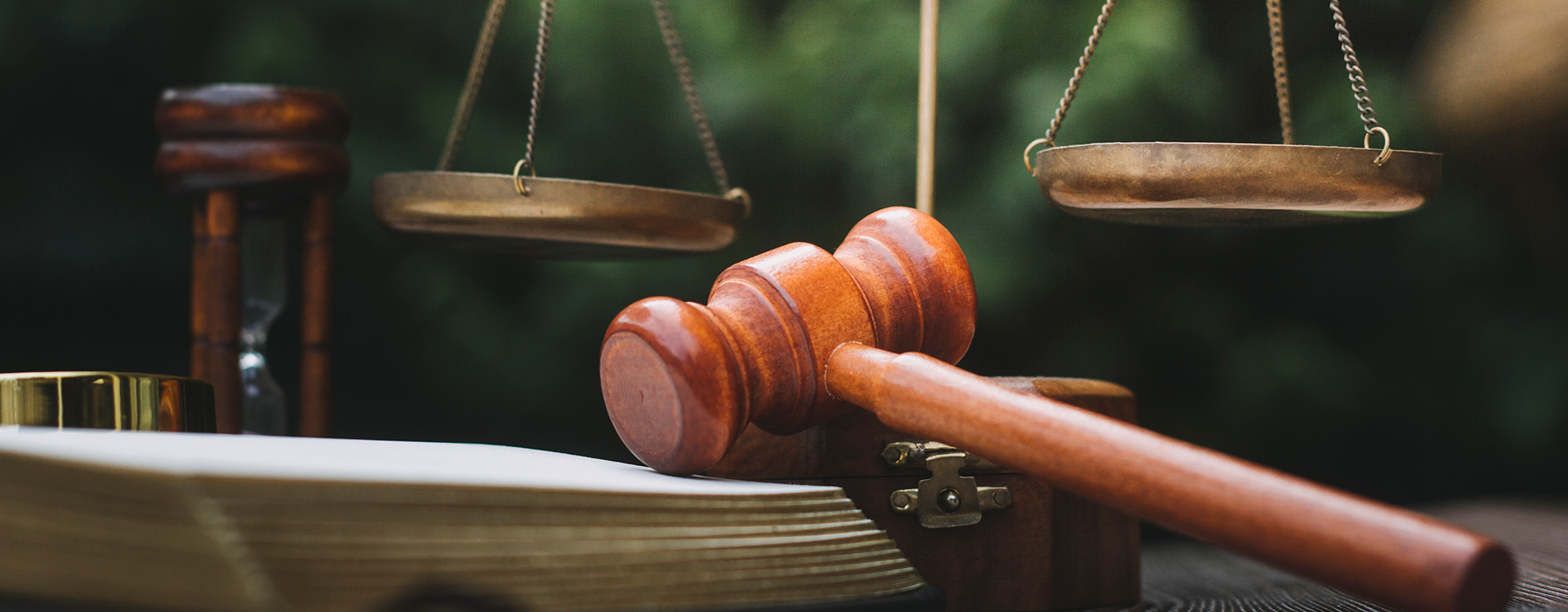 Law book, gavel, and assorted items on table