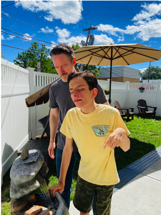 Ivan and his dad at the water fountain.