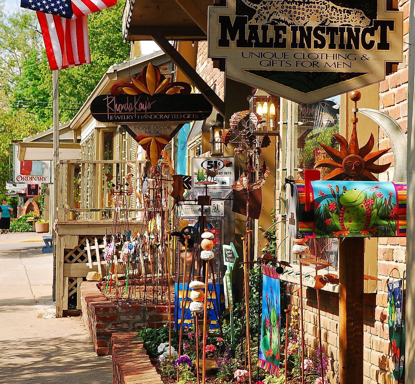 A Boutique Store displays its sales along the sidewalk to entice customers in the charming small town of Nashville, Indiana. Editorial credit: James Kirkikis / Shutterstock.com