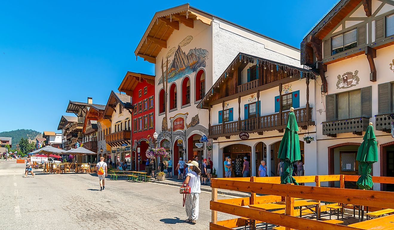 Shops and sidewalk cafes line the quaint Bavarian themed main street of the tourist resort town of Leavenworth. Editorial credit: Kirk Fisher / Shutterstock.com