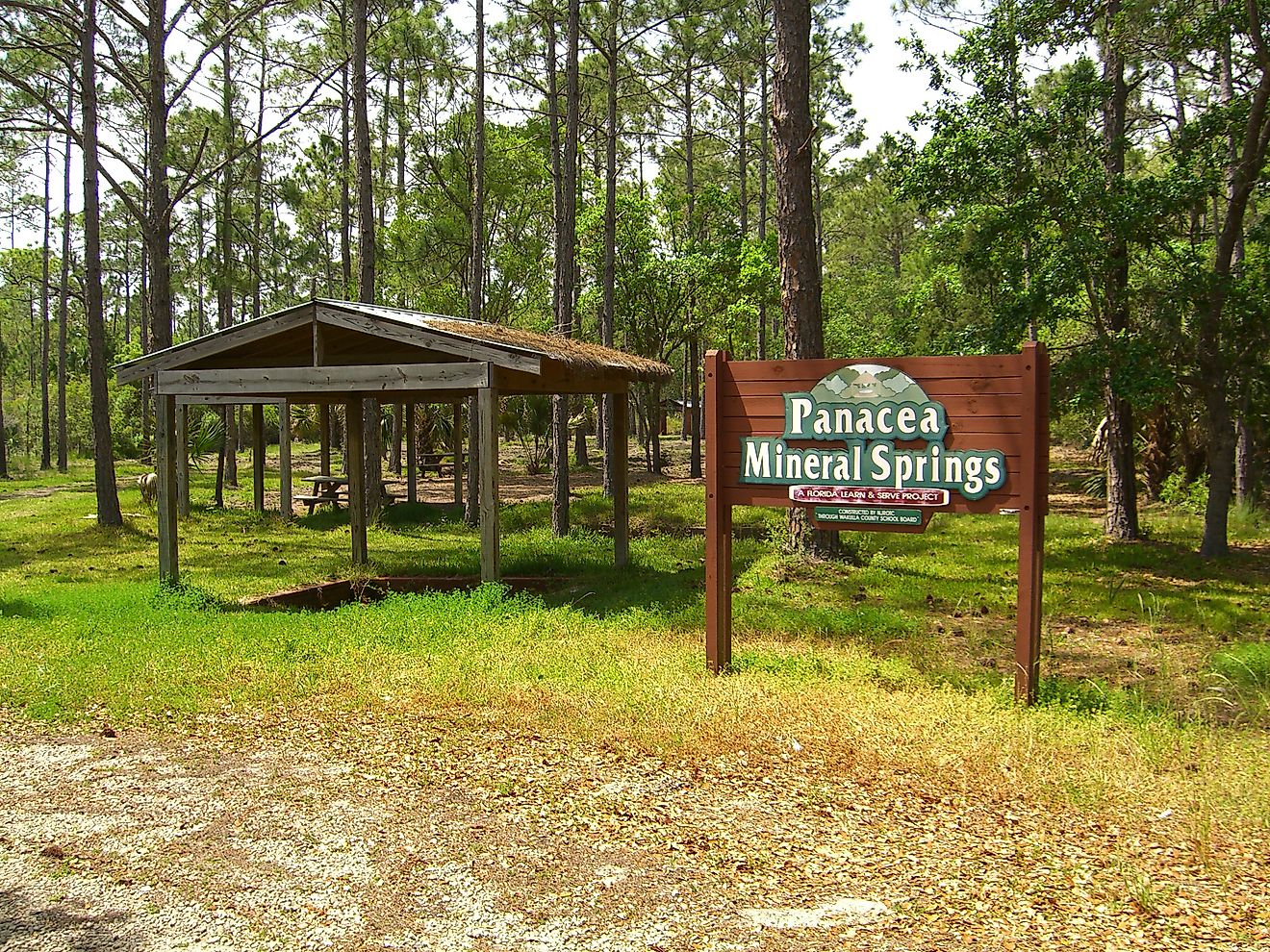 Panacea Mineral Springs in Panacea, Florida, featuring a small pavilion with a gabled roof sheltering the historic spring