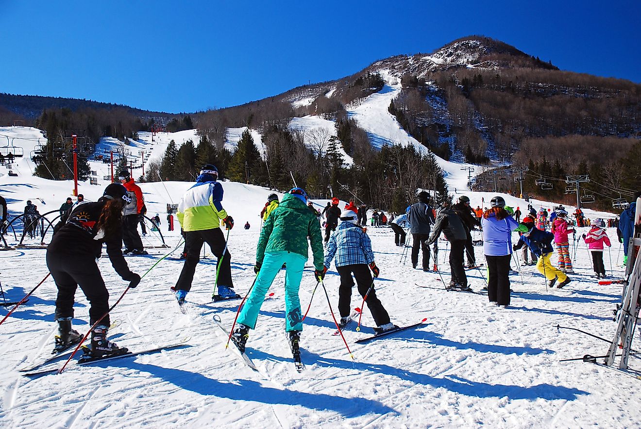 A group of friends learn to ski at a winter resort in Hunter, New York, via Kirkikis / iStock.com