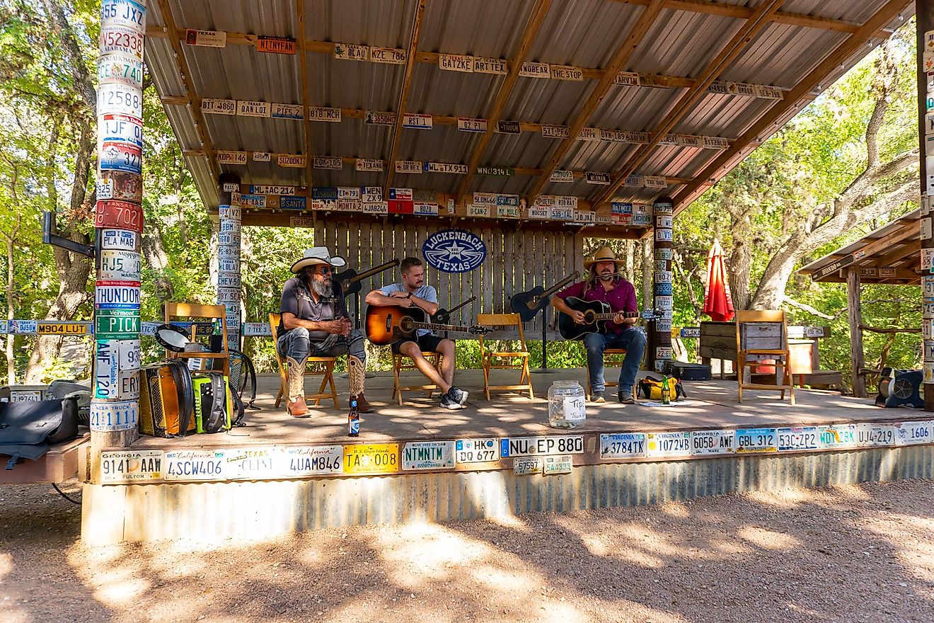 Performers playing music in Luckenbach, Texas, via Marathon Media / Shutterstock.com