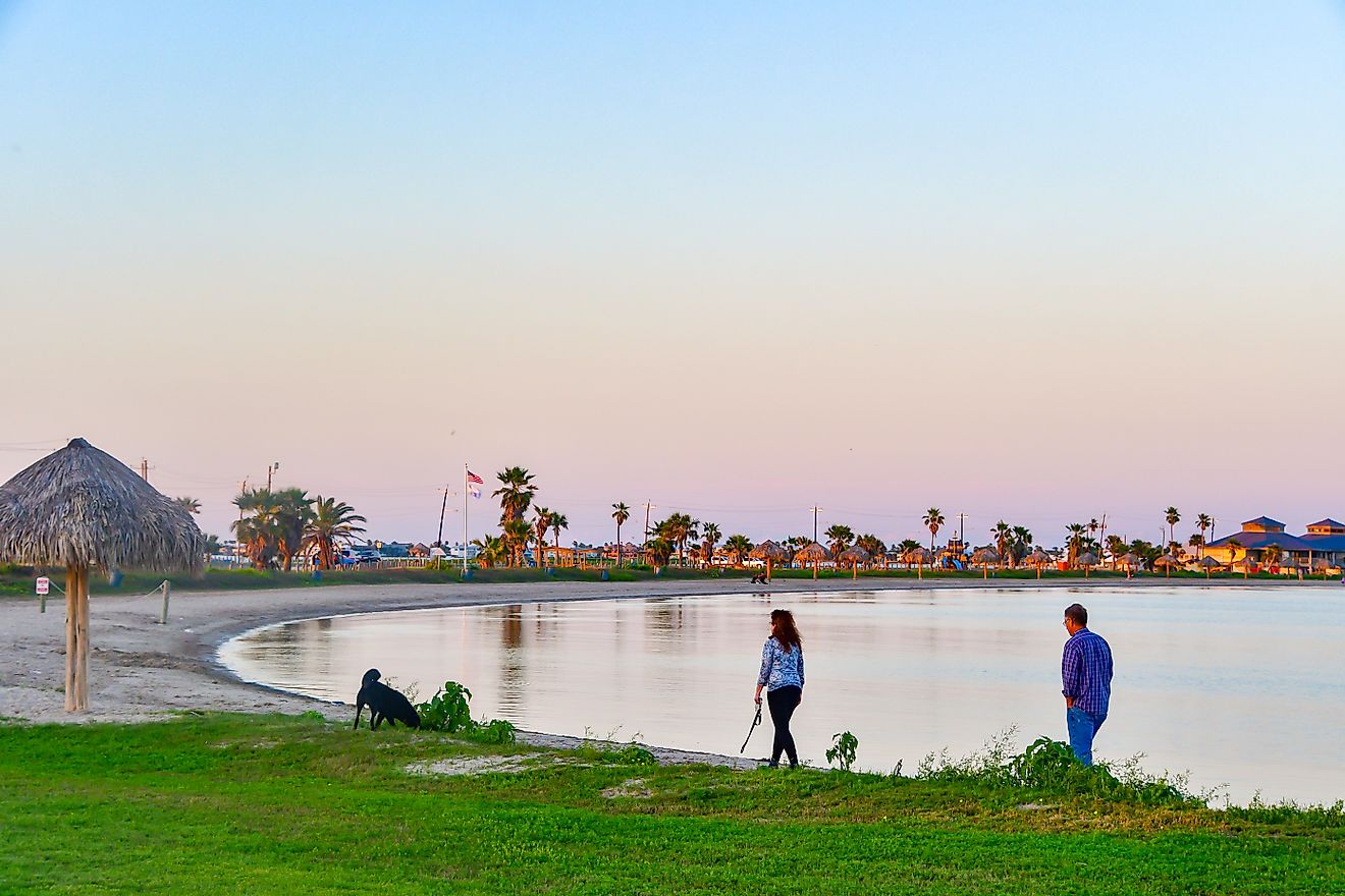 People walking along the beach in Rockport, Texas. Editorial credit: Grossinger / Shutterstock.com