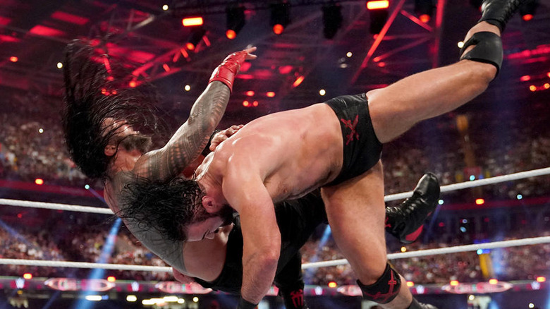 Drew McIntyre attacks Roman Reigns