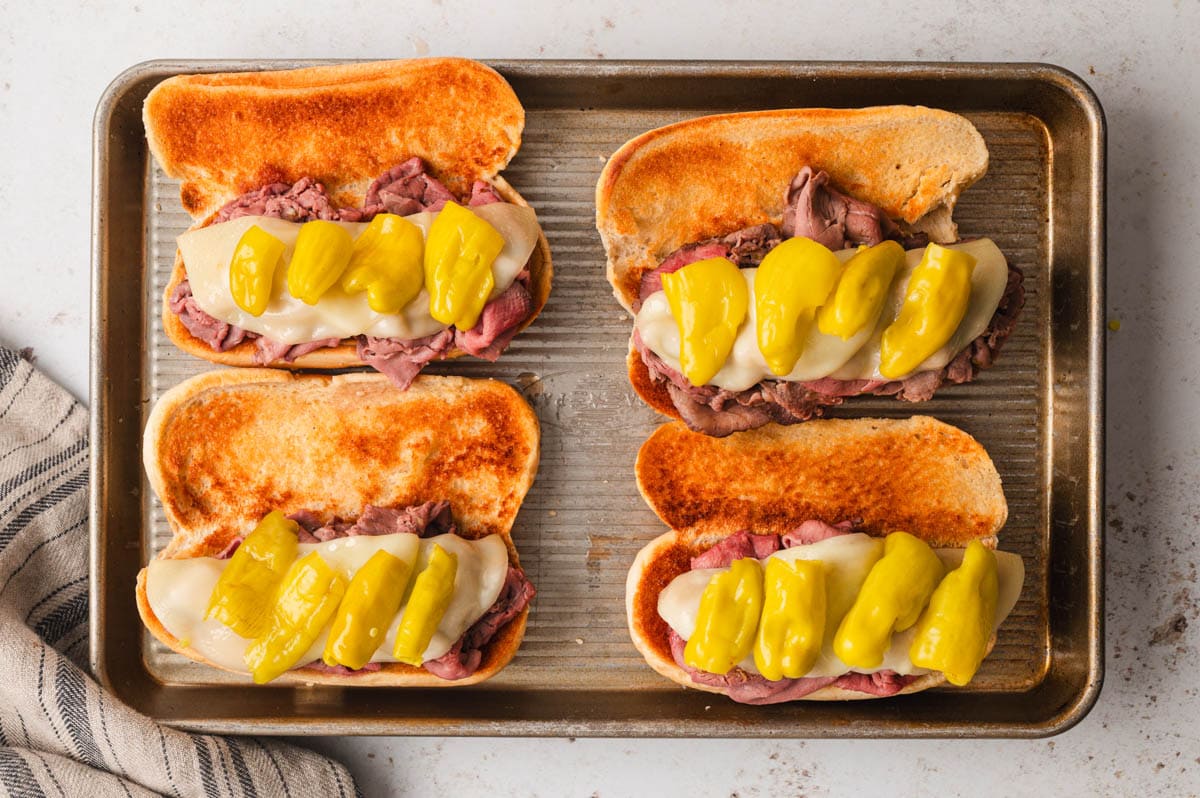 Hoagie rolls with roast beef, cheese and peppers.